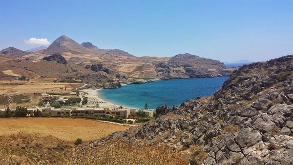 The bay of Plakias opens under the Cretan sun, a blue dream.