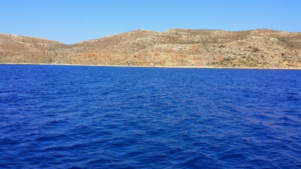 Sailing towards the wild coast, endless blue sea and warm sun.