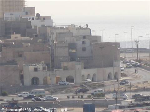 Concrete buildings overlooking the sea, traffic on a multi-lane road