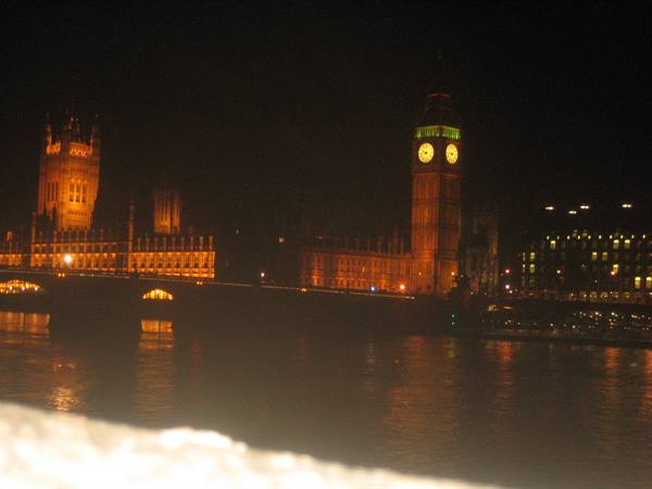 Big Ben and Parliament lit at night, reflections on the Thames, London
