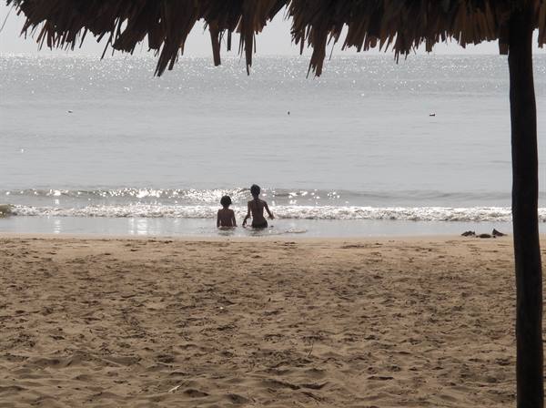 my children bathing at Playa Medina, Paria peninsula