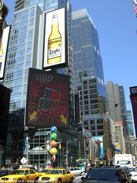 Times Square, New York, Corona and M&M's billboards on skyscrapers, yellow taxis