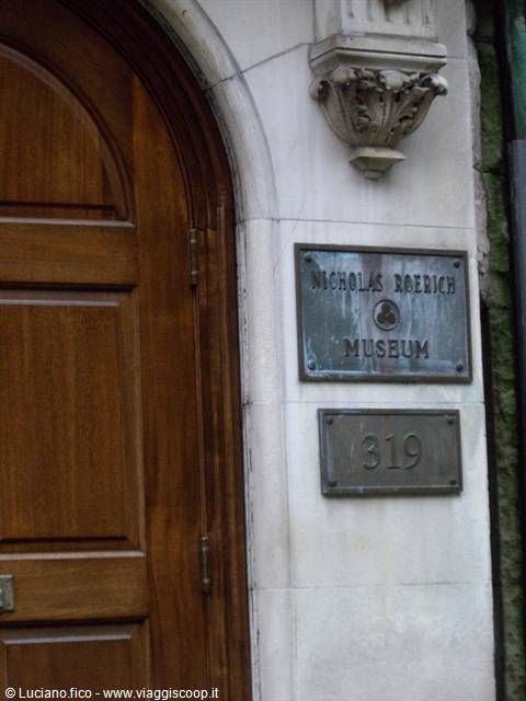 Wooden door and bronze plaques of the Nicholas Roerich Museum at 319