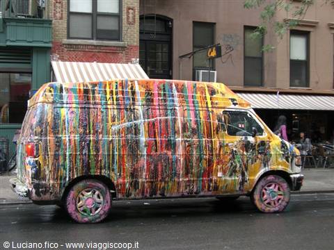 Van covered in dripping colorful paint on a New York street