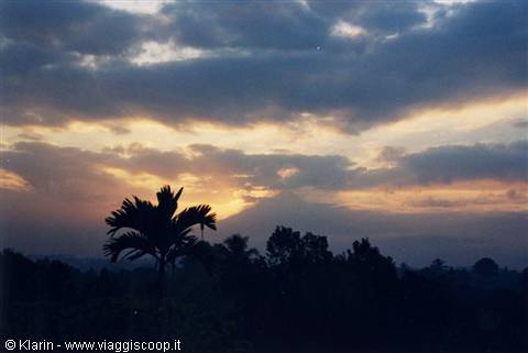 Borobudur - the sun is coming out from behind Mount Merapi