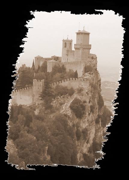 Guaita tower, ancient stone fortress atop misty rocky cliff