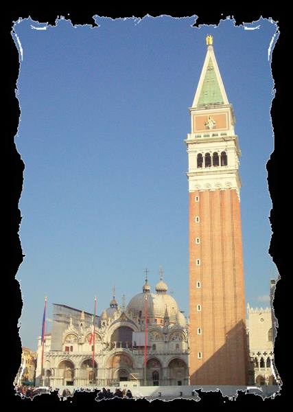 St Mark's brick bell tower rising above the basilica in Venice
