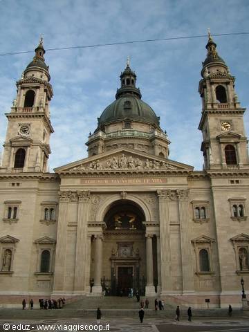 Facade of St. Stephen's Basilica in Budapest with green dome and two bell towers