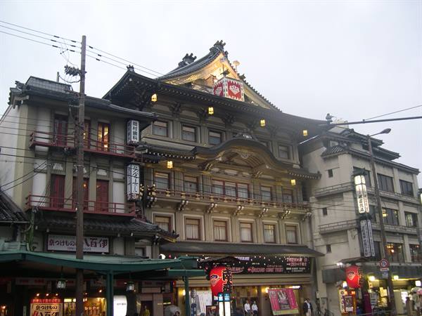 Minamiza theater in Kyoto, traditional facade with lanterns and neon signs