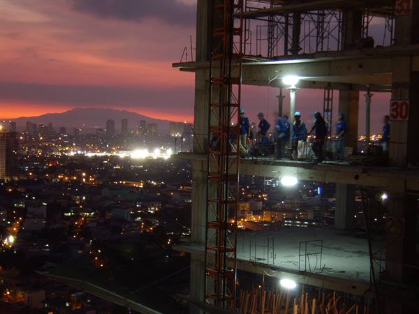 Manila - Another workday comes to an end on the 30th floor of a new skyscraper...