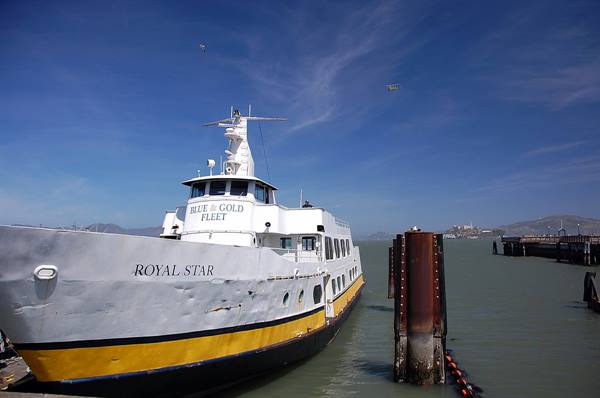 The Blue & Gold Fleet ferry Royal Star moored at the pier under blue sky