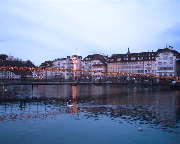 Footbridge decorated with Christmas lights over the Reuss river, Lucerne