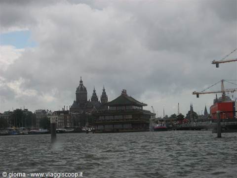 Floating Chinese restaurant and St. Nicholas basilica across the IJ, Amsterdam