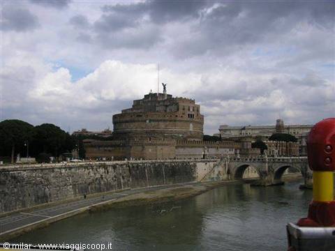 Brick Castel Sant'Angelo above the Tiber, cloudy sky, stone bridge