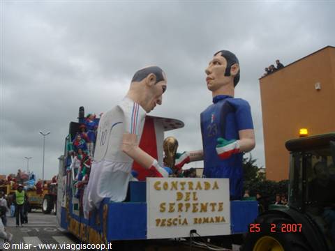 Carnival float with giant papier-mâché footballers at Tresca Romana parade