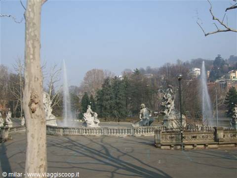 Fountain of the Months in Turin, stone statues and winter water jets