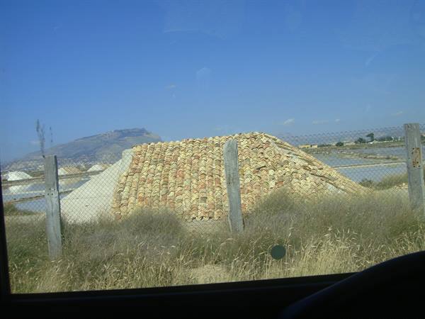 Salt mound covered with terracotta tiles at the Trapani salt pans