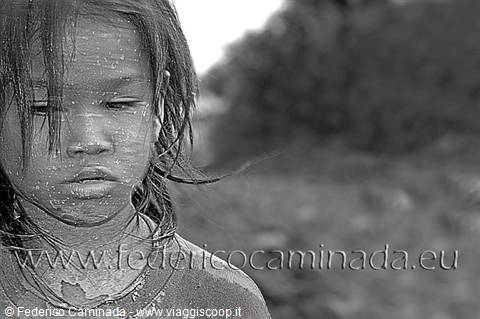 Black and white portrait of a young girl with wet hair and thoughtful gaze