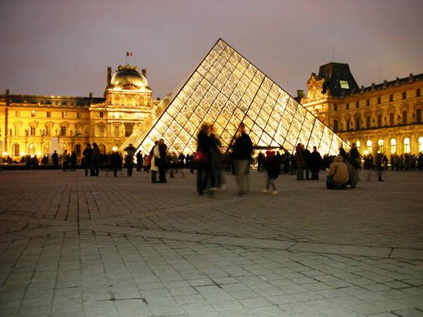 outside the Louvre in the evening