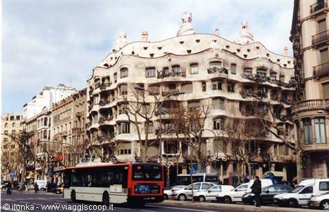Gaudí's La Pedrera in Barcelona with bus and traffic on Passeig de Gràcia
