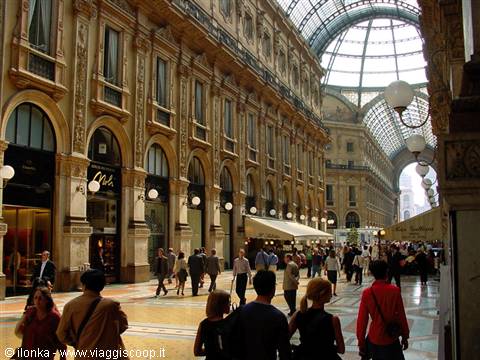 Galleria Vittorio Emanuele II in Milan: visitors strolling under the glass and iron dome