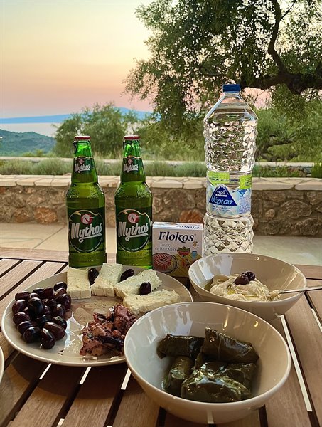 Greek sunset, olives, dolmades and a Mythos: happiness is simple.