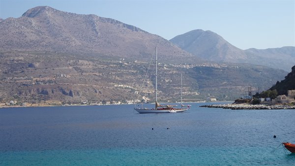 A quiet bay, still sails: time has stood still here with us.