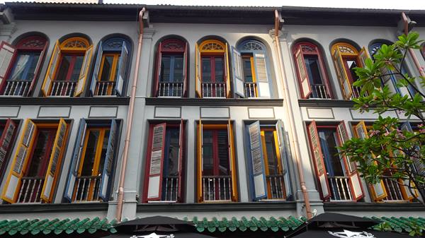 Colonial shophouses with open colorful shutters, Singapore