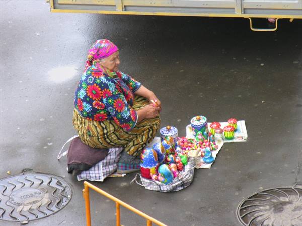 Babushka with souvenirs in Pushkin Square