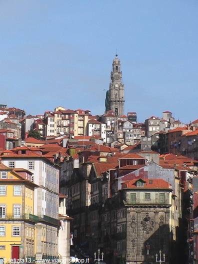 Colorful houses climb up toward the Torre dos Clérigos, Porto