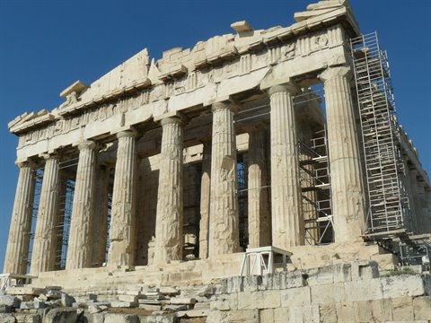 The Parthenon on the Athens Acropolis, marble columns and scaffolding under a blue sky