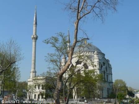 Ortaköy Mosque with its minaret under a clear blue sky