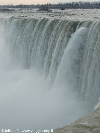 The mighty Horseshoe Falls of Niagara plunge into rising mist