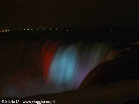Niagara Falls at night lit by colored lights