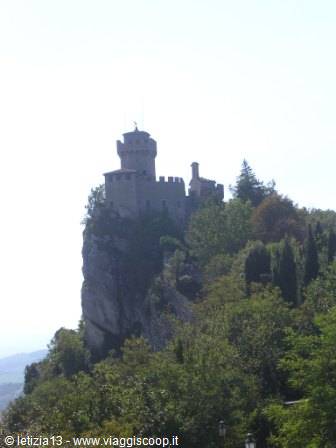 San Marino's First Tower stands on the rocky cliff among trees