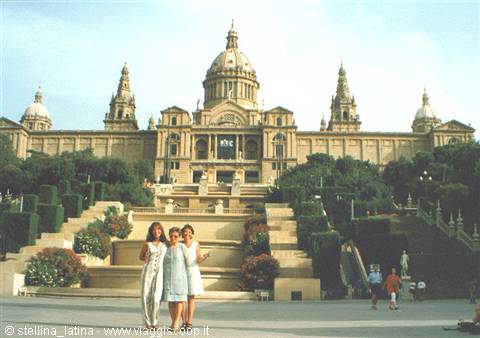 Tourists posing in front of the Palau Nacional MNAC on Montjuïc, Barcelona