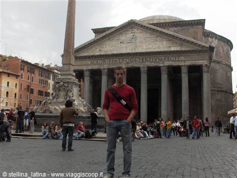 Tourist in front of Rome's Pantheon, obelisk and fountain nearby