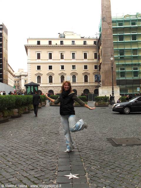 Girl hopping on a marble star in Piazza Colonna, Rome, near the obelisk