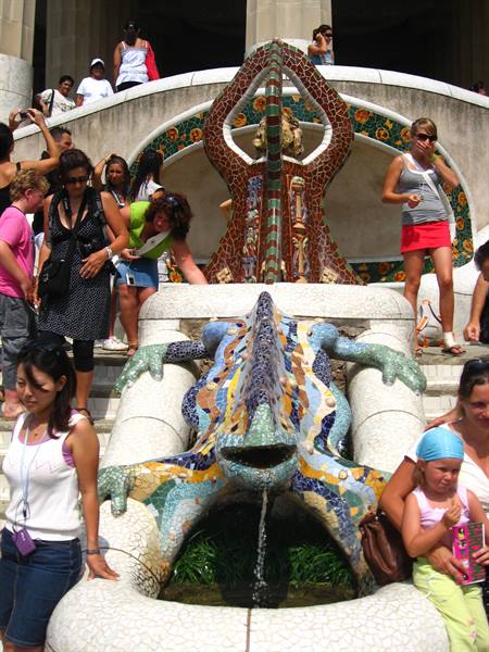 Tourists around the mosaic salamander fountain at Park Güell, Barcelona