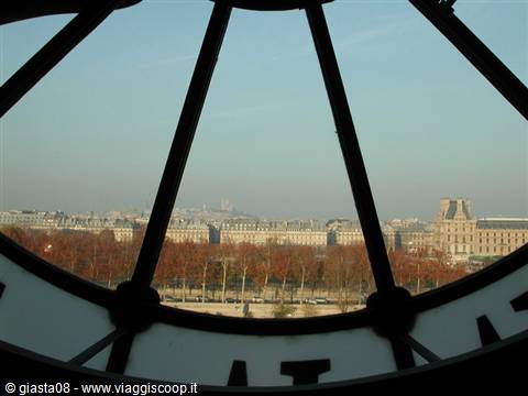 Paris seen through the Musée d'Orsay clock, Seine and Tuileries gardens