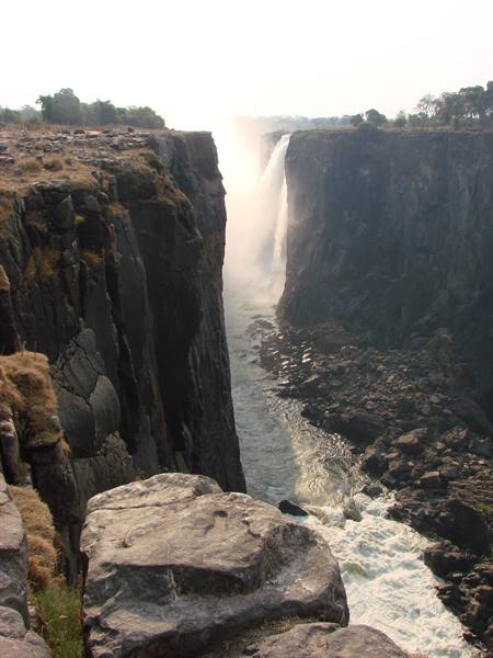 Victoria Falls, Zambezi river water plunging into the rocky gorge