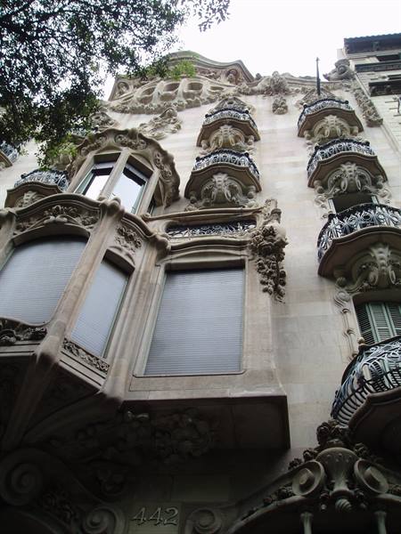Modernist stone facade with wrought-iron balconies, Passeig de Gràcia, Barcelona