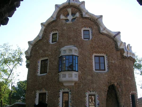 Stone house with white curvy gable, Gaudí's Park Güell, Barcelona