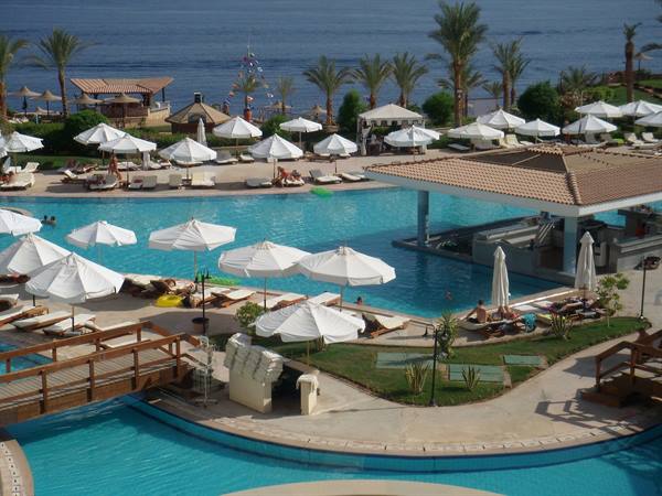 the pool bar on the right and the beach bar at the far left