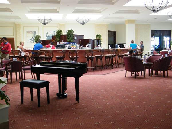 bar with piano bar next to the main restaurant