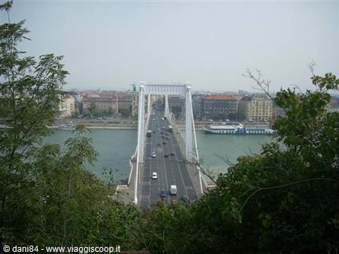 White suspension bridge spanning the Danube with traffic, Budapest