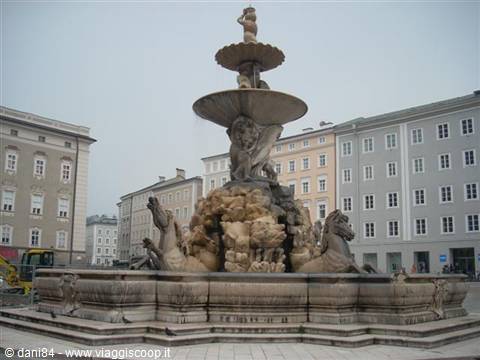 Baroque fountain with sea horses and dolphins on Residenzplatz square in Salzburg