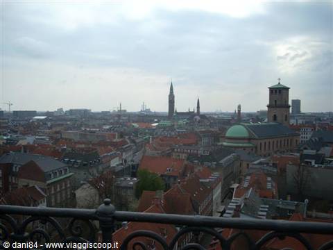 Copenhagen rooftops and spires seen from the Round Tower, cloudy sky