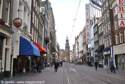 Amsterdam street with tram tracks, Cineac sign and distant tower