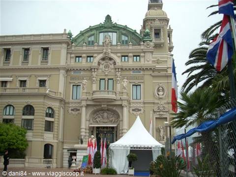 Belle Époque facade of Monte Carlo Casino with flags and white tent